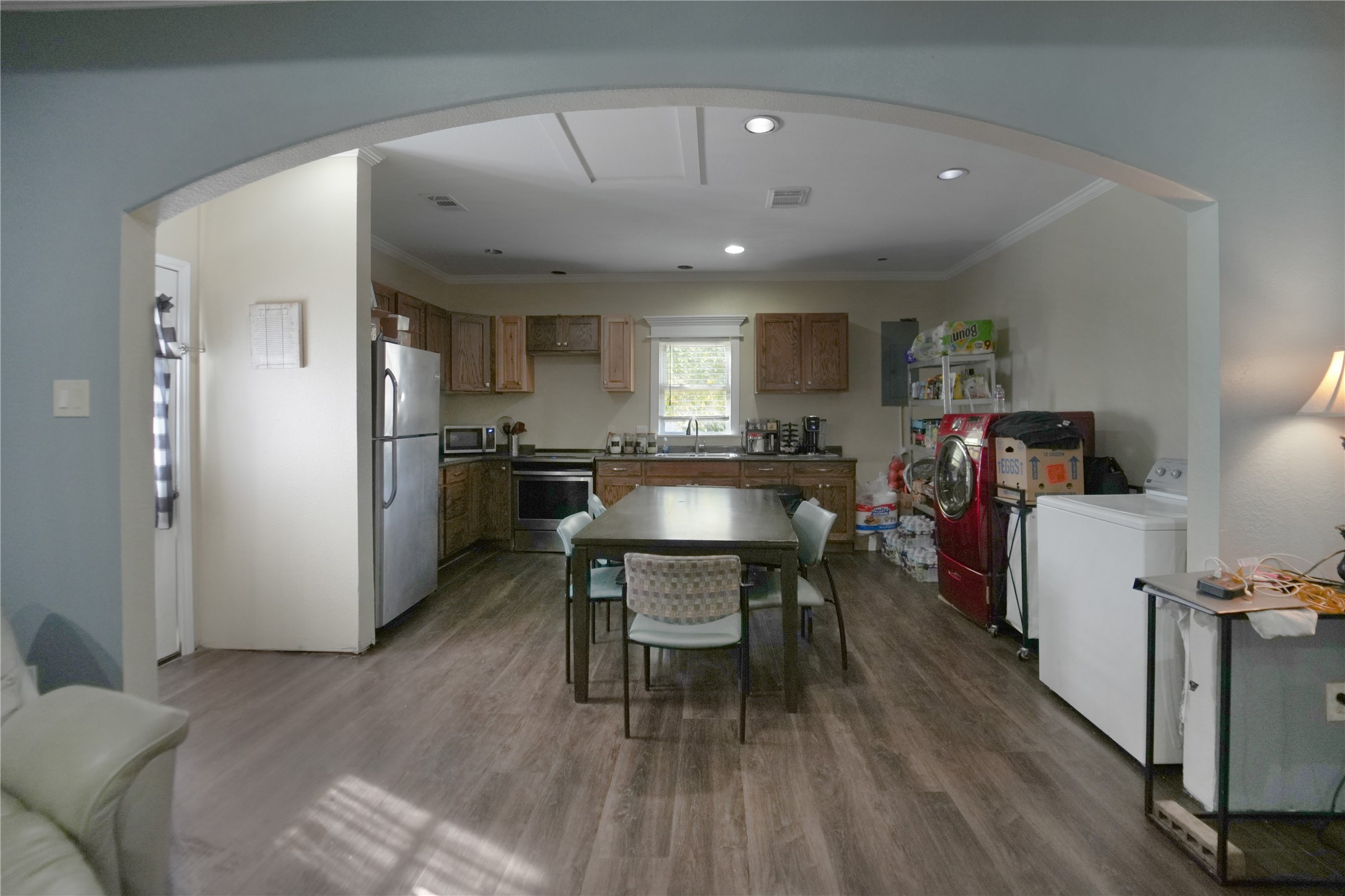 13475 5th Street Splendora, TX 77372 - Photo 8 of 16 a living room with furniture and a dining table with wooden floor