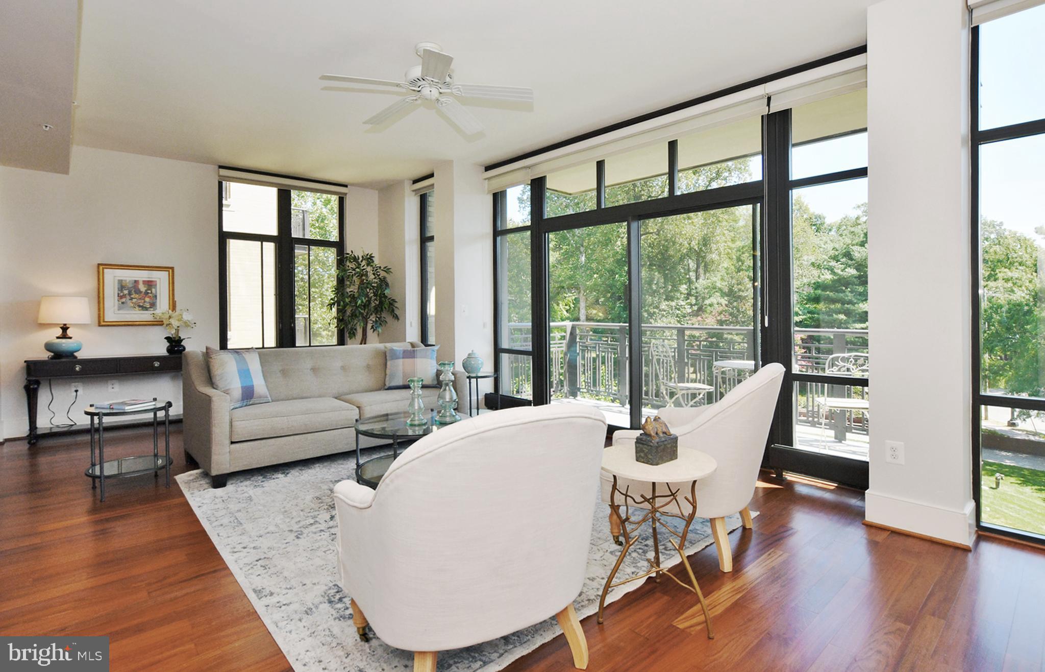 4301 Military Road Northwest, Unit 407 Washington, DC 20015 - Photo 6 of 44 3 Sides of Floor-to-Ceiling Windows & Balcony