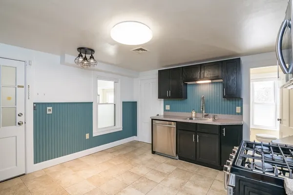 a spacious bathroom with a sink and a mirror
