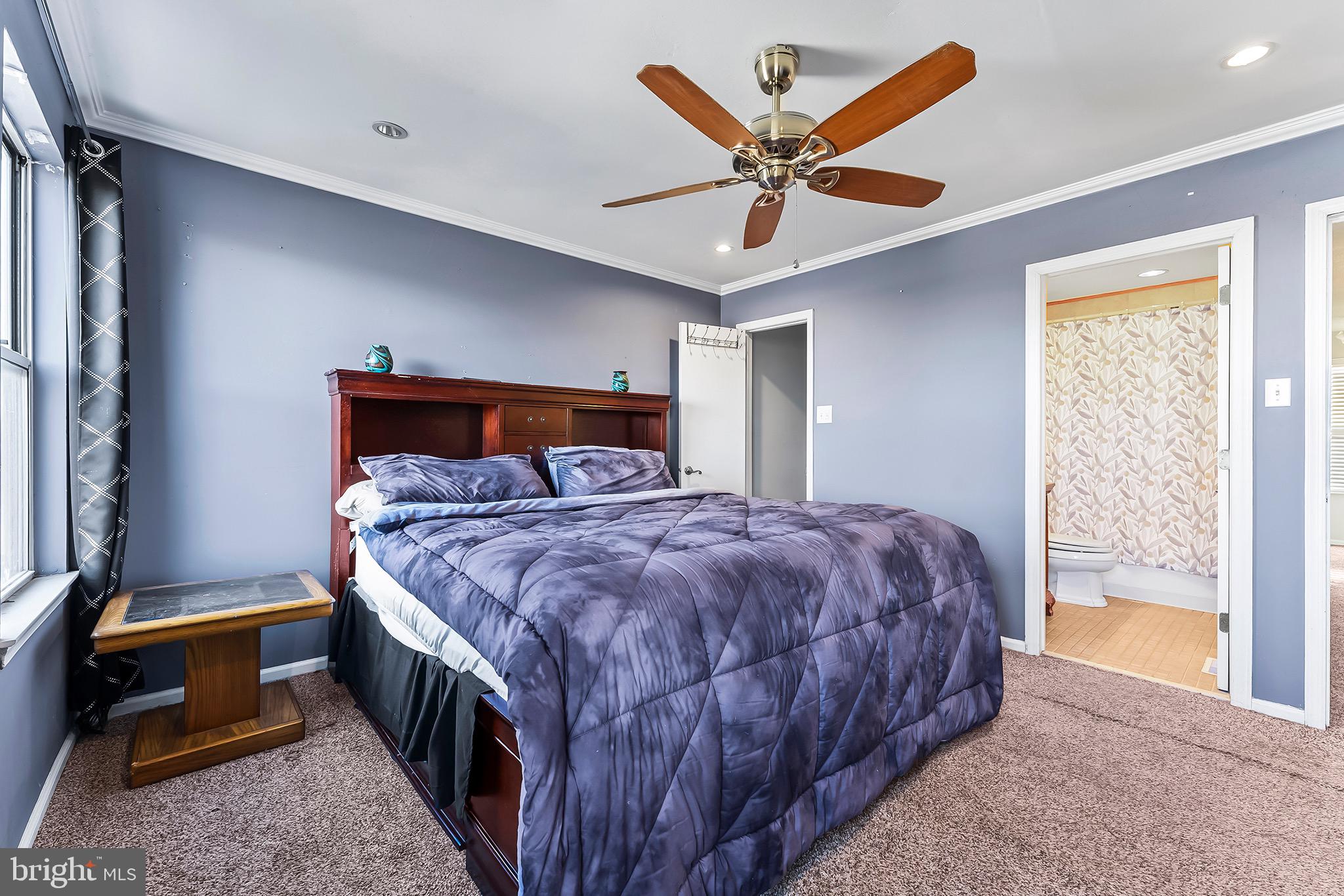 223 Stirrup Road Swedesboro, NJ 08085 - Photo 20 of 30 a bedroom with a bed and a chandelier