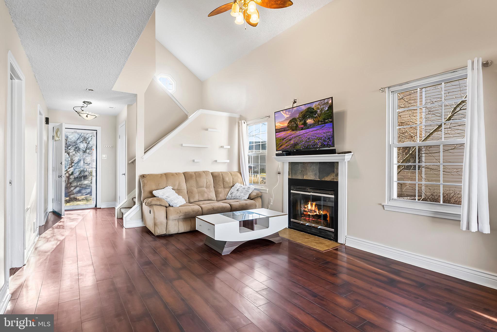 223 Stirrup Road Swedesboro, NJ 08085 - Photo 6 of 30 a living room with furniture fireplace and wooden floor