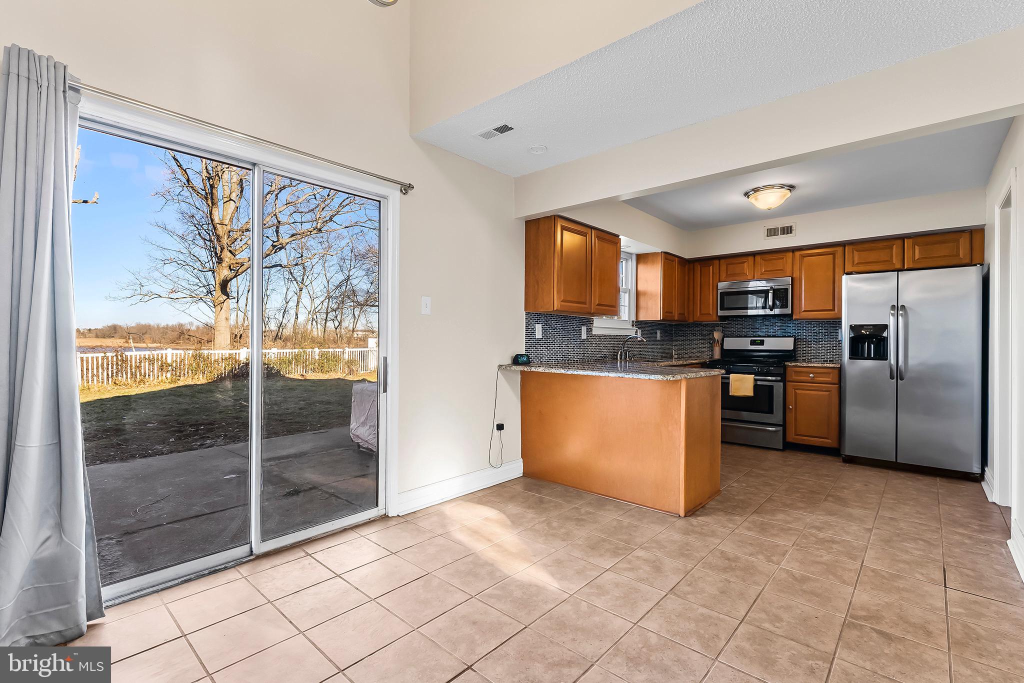 223 Stirrup Road Swedesboro, NJ 08085 - Photo 8 of 30 a kitchen with stainless steel appliances granite countertop a refrigerator and a sink