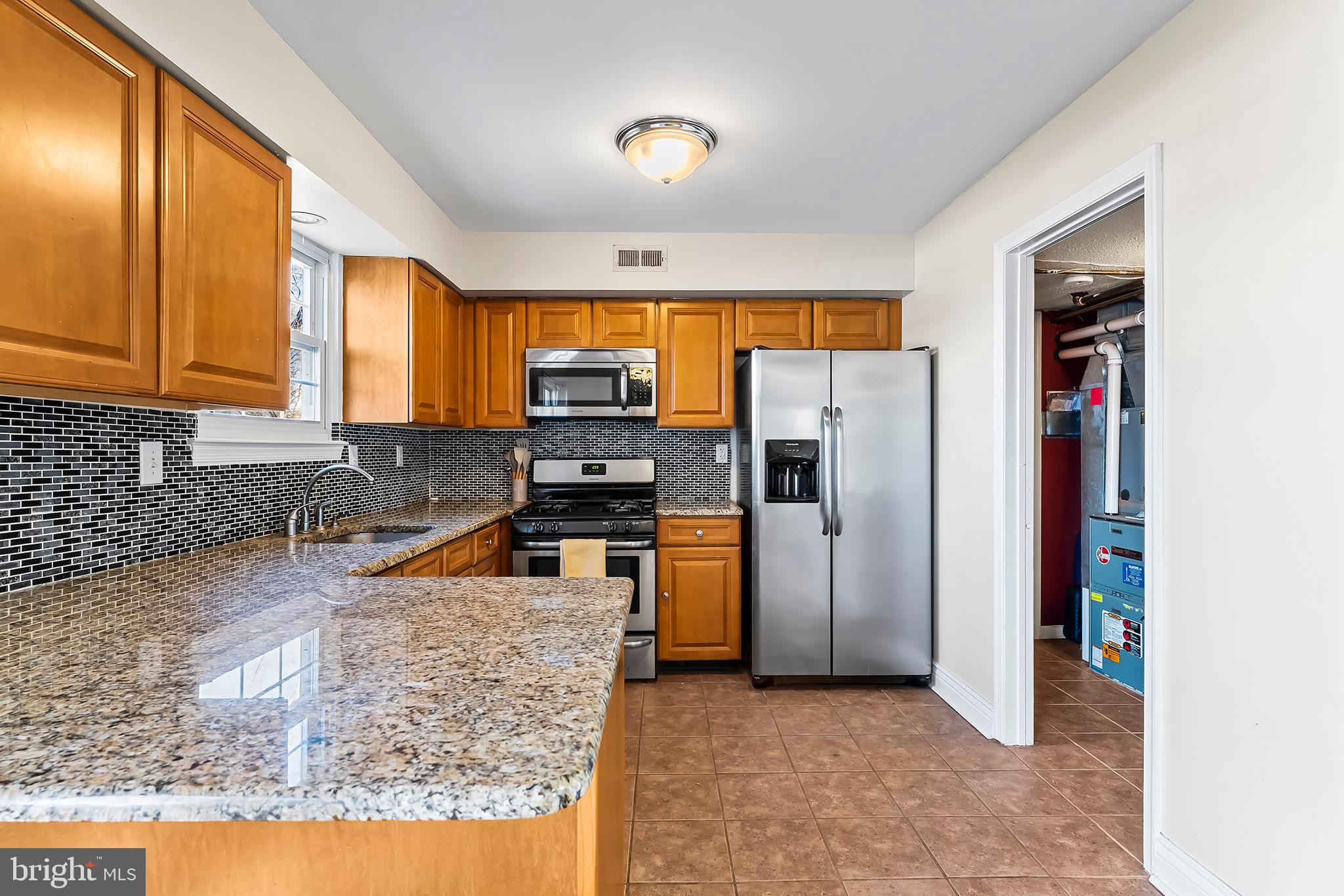 223 Stirrup Road Swedesboro, NJ 08085 - Photo 9 of 30 a kitchen with stainless steel appliances granite countertop a refrigerator a stove and a sink