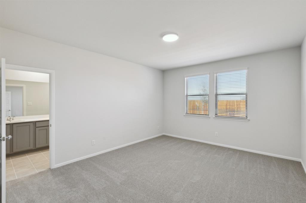 509 River Rdg Drive McKinney, TX 75071 - Photo 16 of 28 an empty room with a bathroom and a window