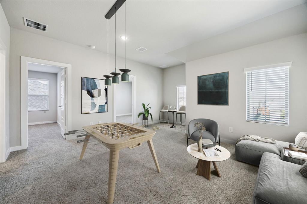 509 River Rdg Drive McKinney, TX 75071 - Photo 23 of 28 a living room with furniture a window and a flat screen tv