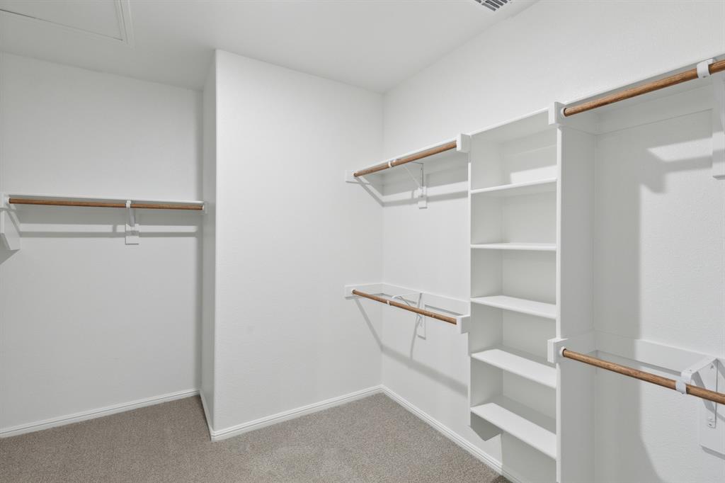 509 River Rdg Drive McKinney, TX 75071 - Photo 31 of 39 Primary Closet in the Holden home plan by Trophy Signature Homes – REPRESENTATIVE PHOTO