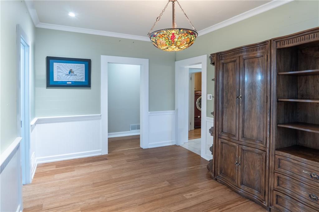 1815 Pickens Street Ball Ground, GA 30107 - Photo 21 of 38 a view of hallway with wooden floor and kitchen