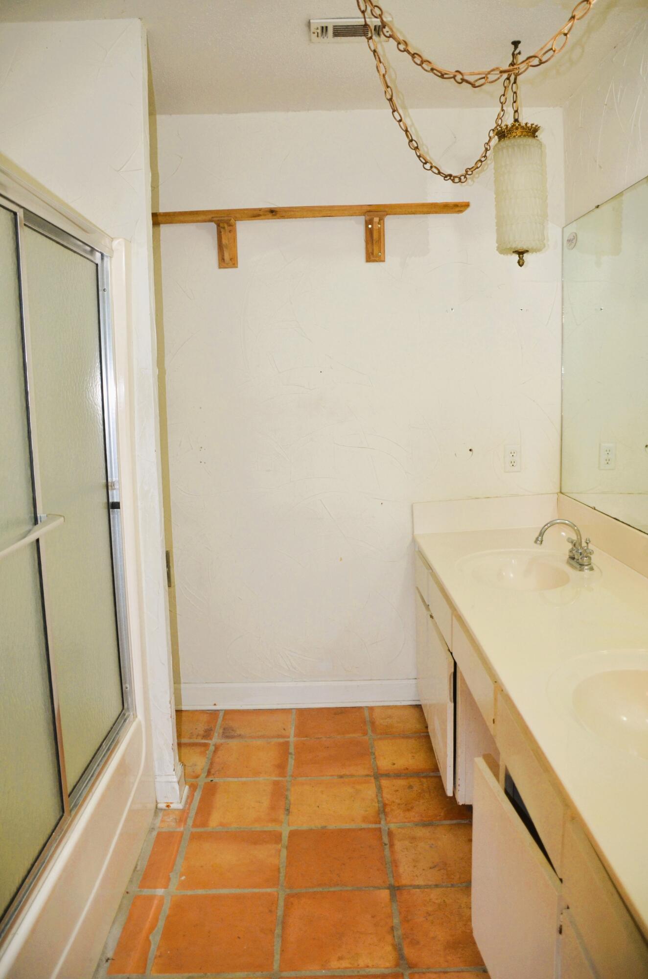 515 Beach Drive Destin, FL 32541 - Photo 11 of 43 a bathroom with a sink and a shower
