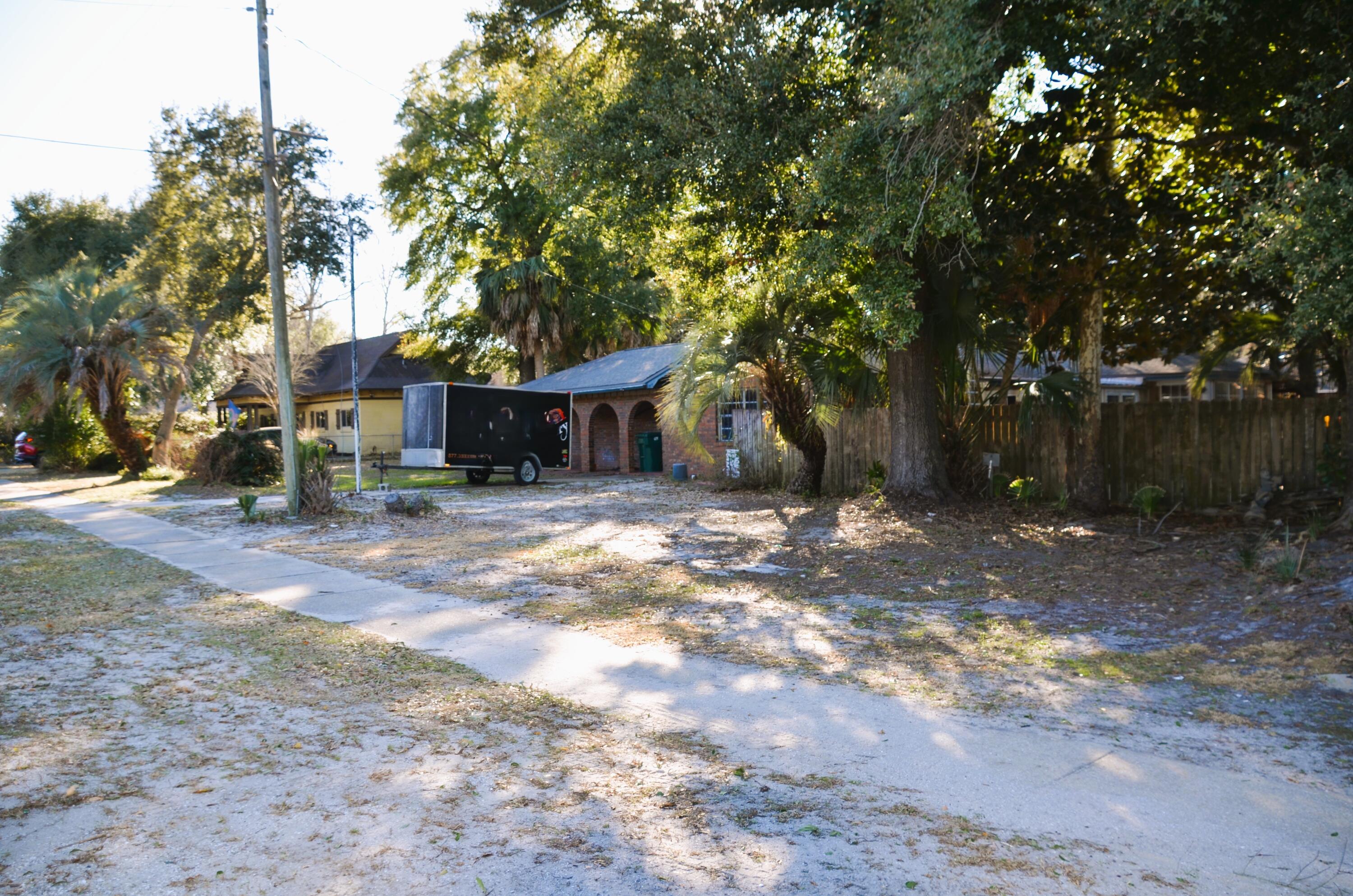 515 Beach Drive Destin, FL 32541 - Photo 38 of 43 a view of a house with a yard