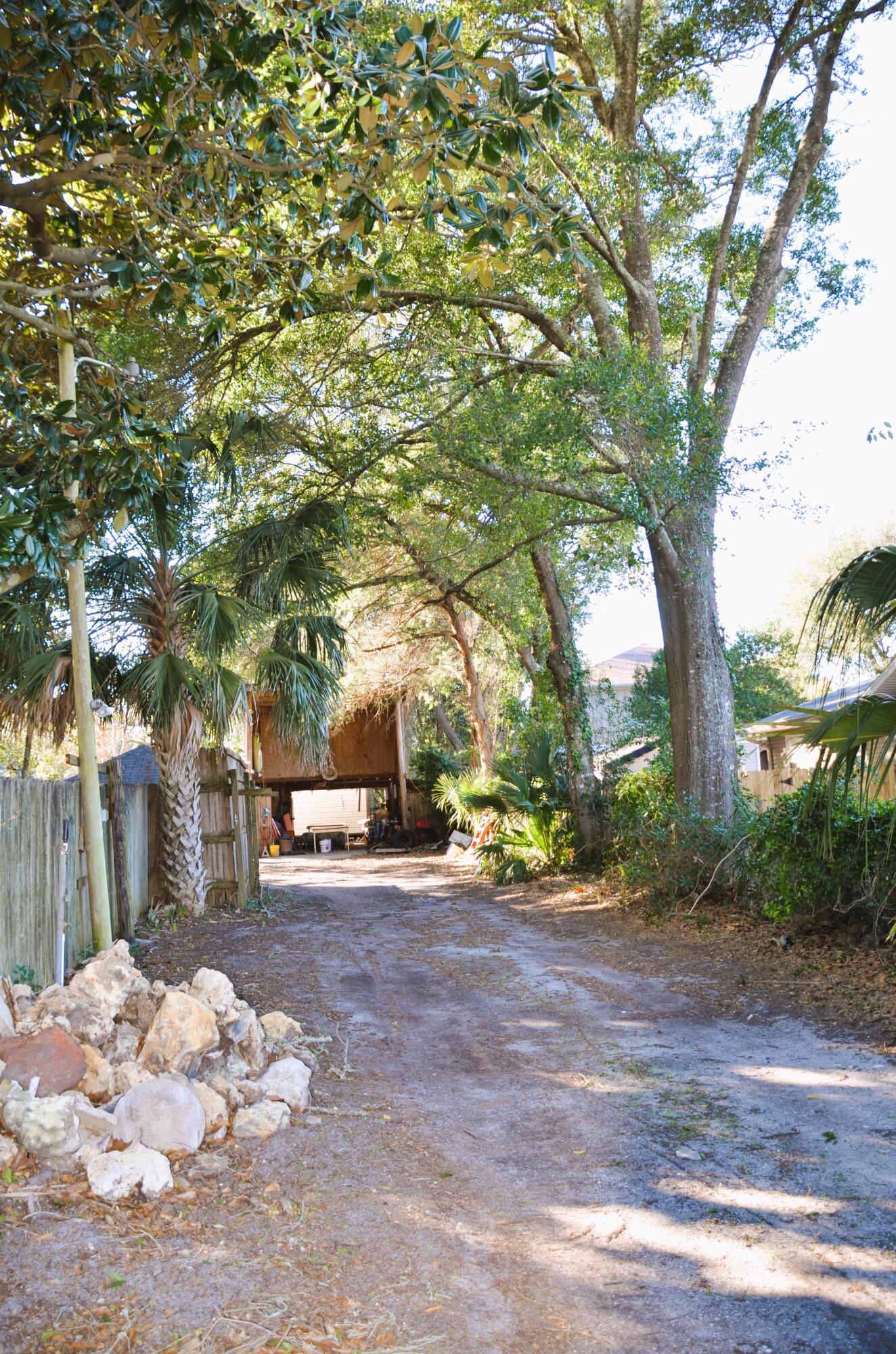 515 Beach Drive Destin, FL 32541 - Photo 40 of 43 a view of a yard with plants and trees