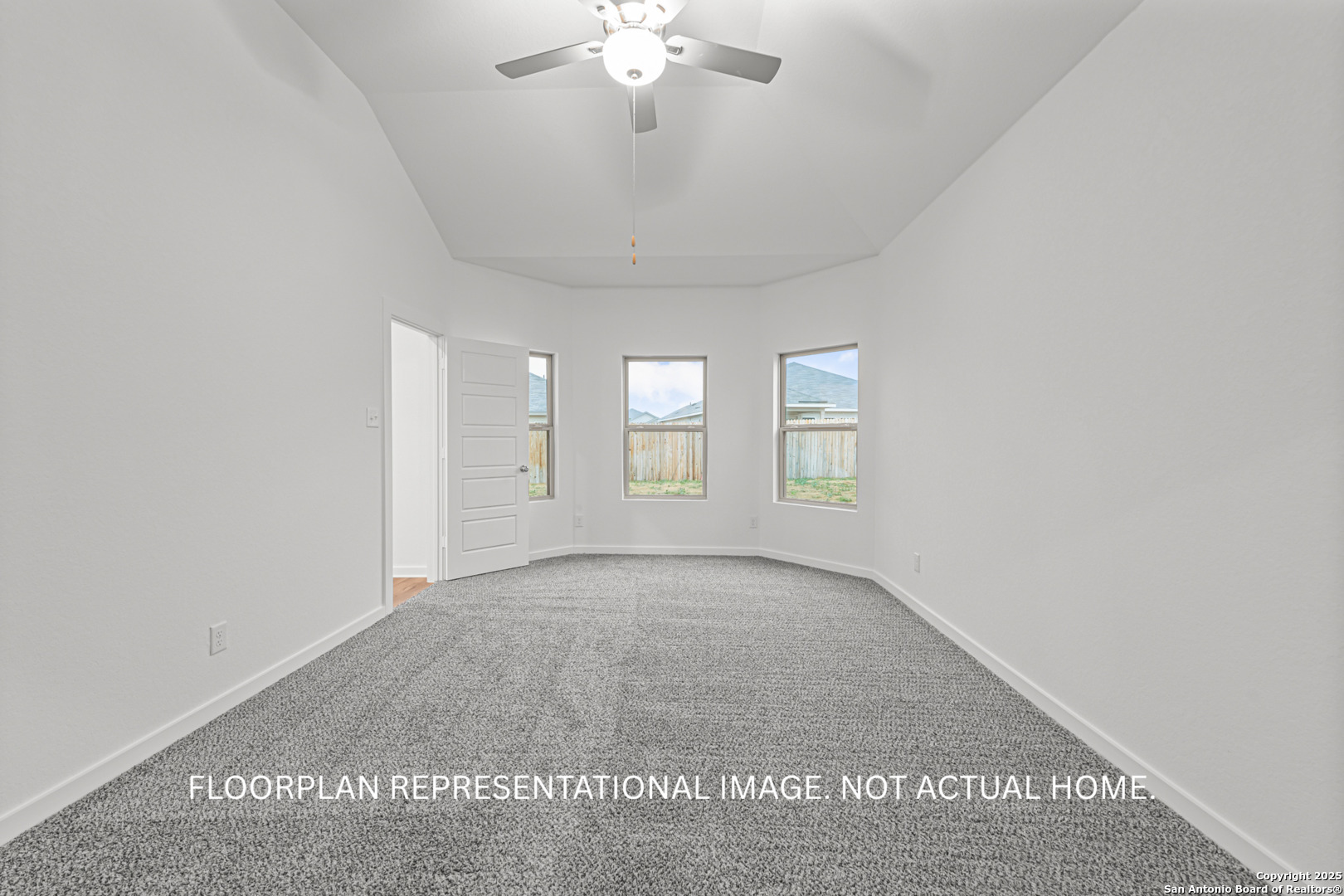 10411 Hotspur Road Converse, TX 78109 - Photo 16 of 47 an empty room with chandelier fan and windows
