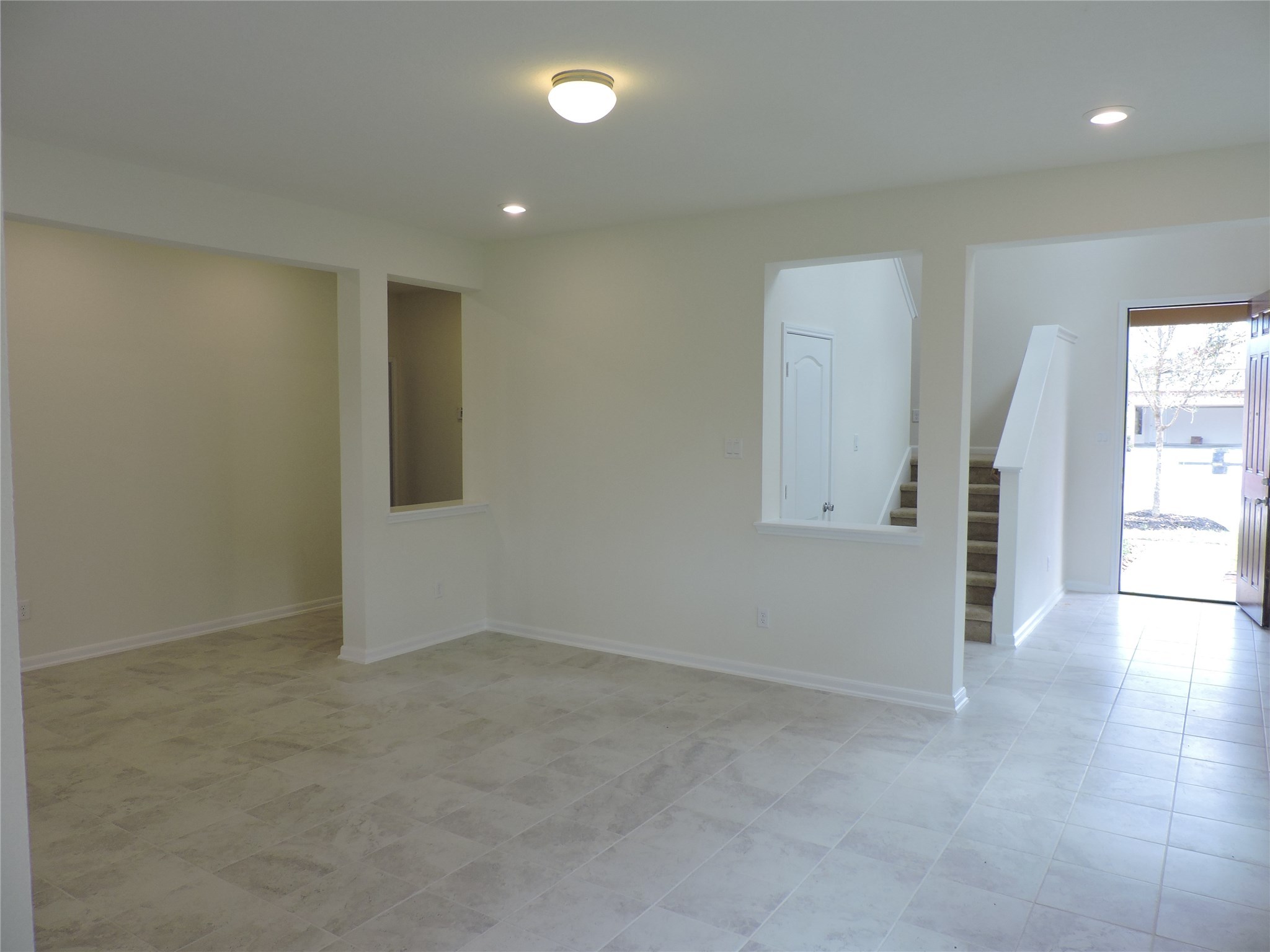 1122 Epworth Ct. Conroe, TX 77304 - Photo 15 of 35 an empty room with windows and entrance