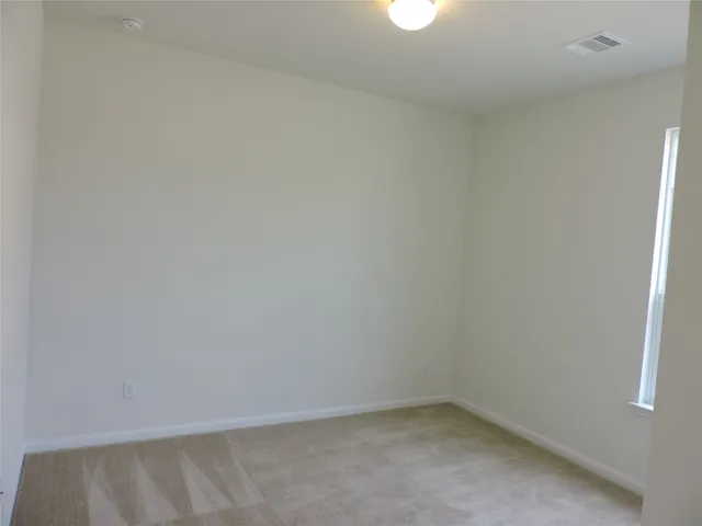 a bathroom with a granite countertop bathtub shower sink vanity and toilet