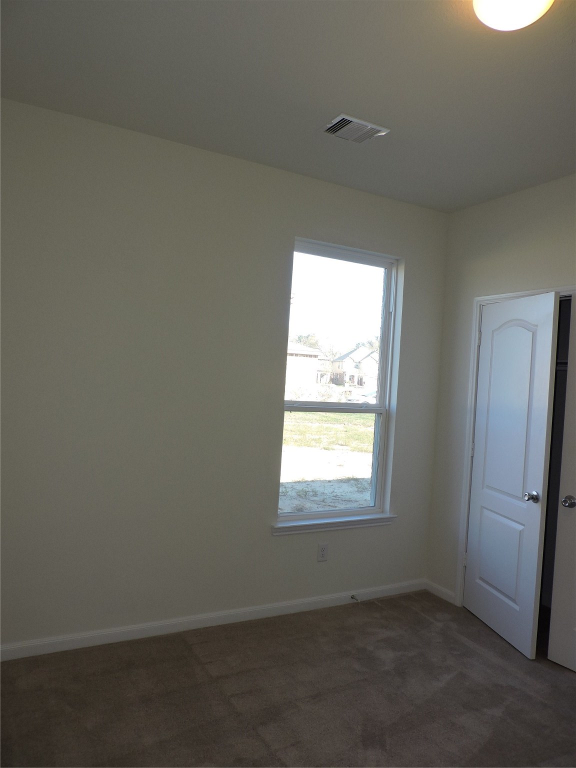1122 Epworth Ct. Conroe, TX 77304 - Photo 19 of 35 an empty room with a window