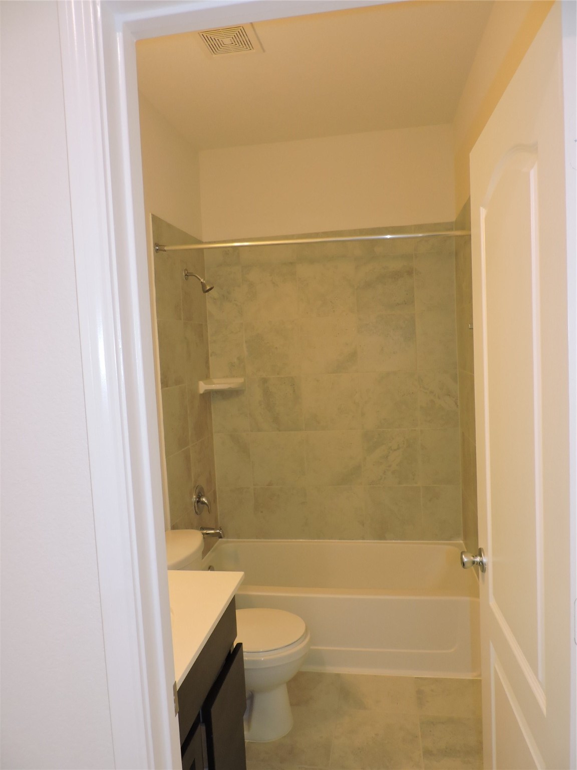 1122 Epworth Ct. Conroe, TX 77304 - Photo 20 of 35 a bathroom with a granite countertop bathtub shower sink vanity and toilet