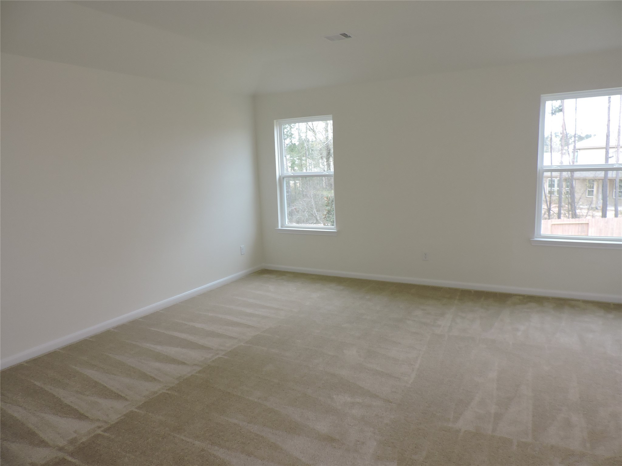 1122 Epworth Ct. Conroe, TX 77304 - Photo 23 of 35 an empty room with a window