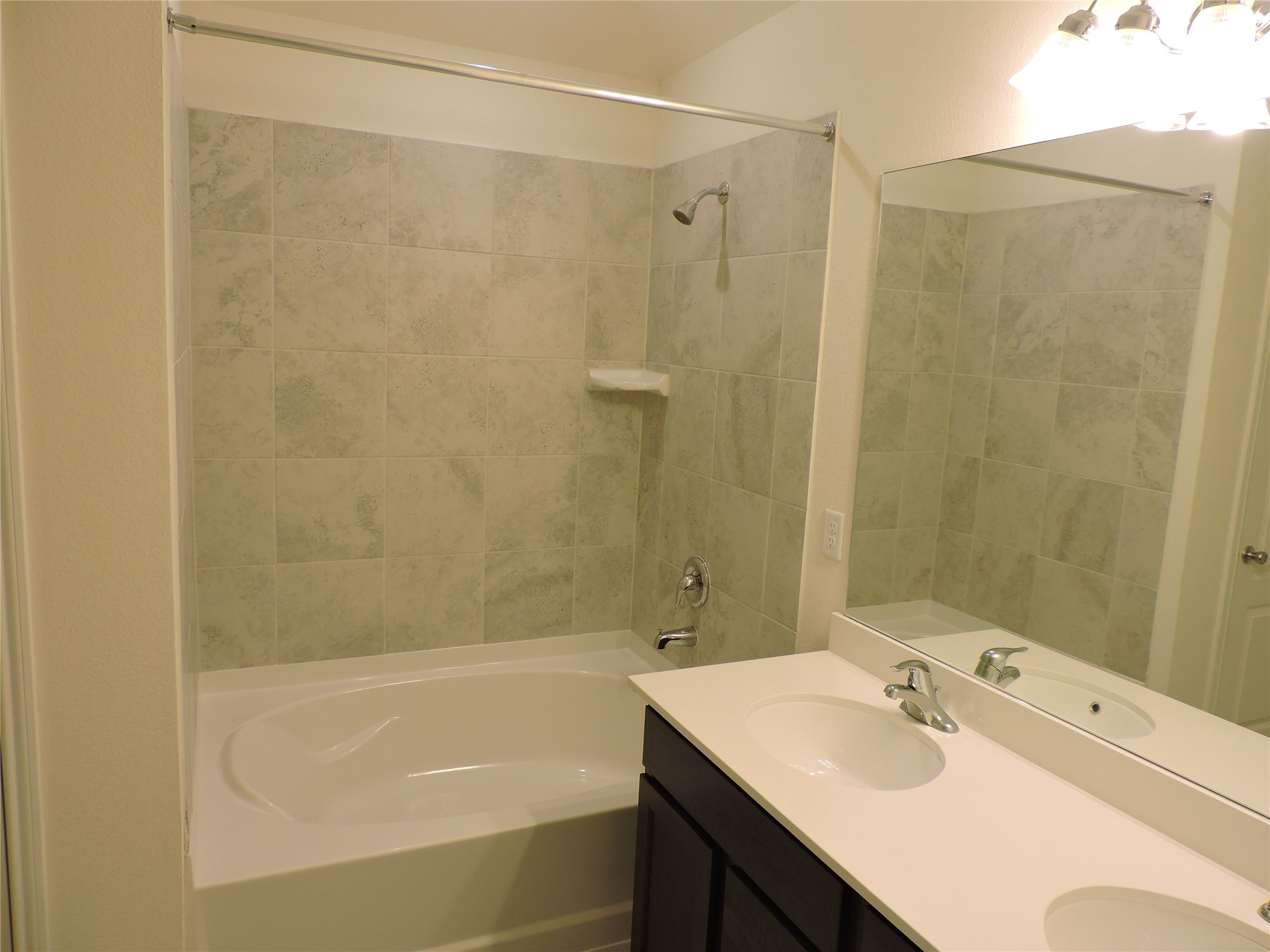 1122 Epworth Ct. Conroe, TX 77304 - Photo 25 of 35 a bathroom with a sink and a bathtub