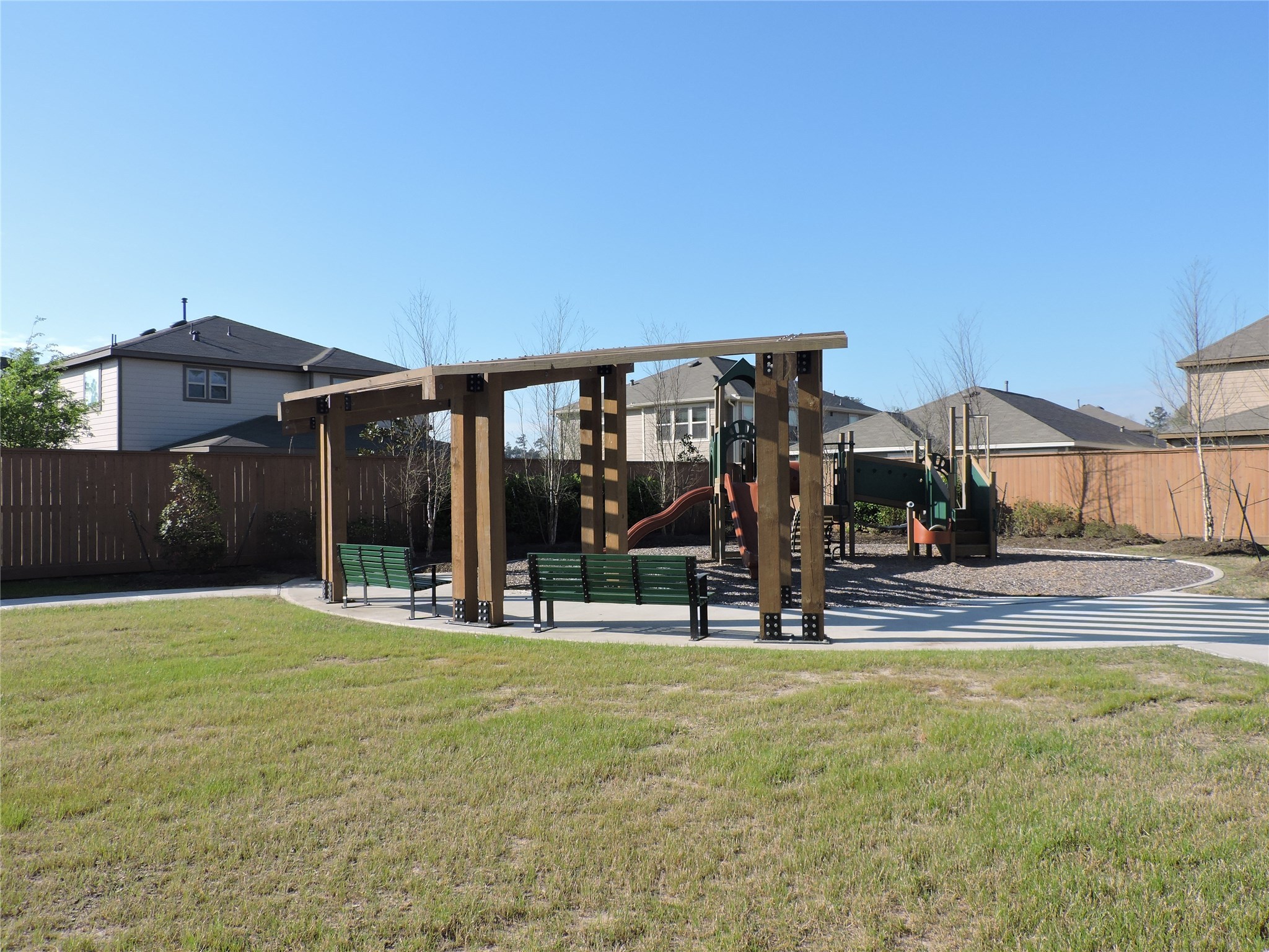 1122 Epworth Ct. Conroe, TX 77304 - Photo 34 of 35 a view of a house with floor to ceiling windows and yard
