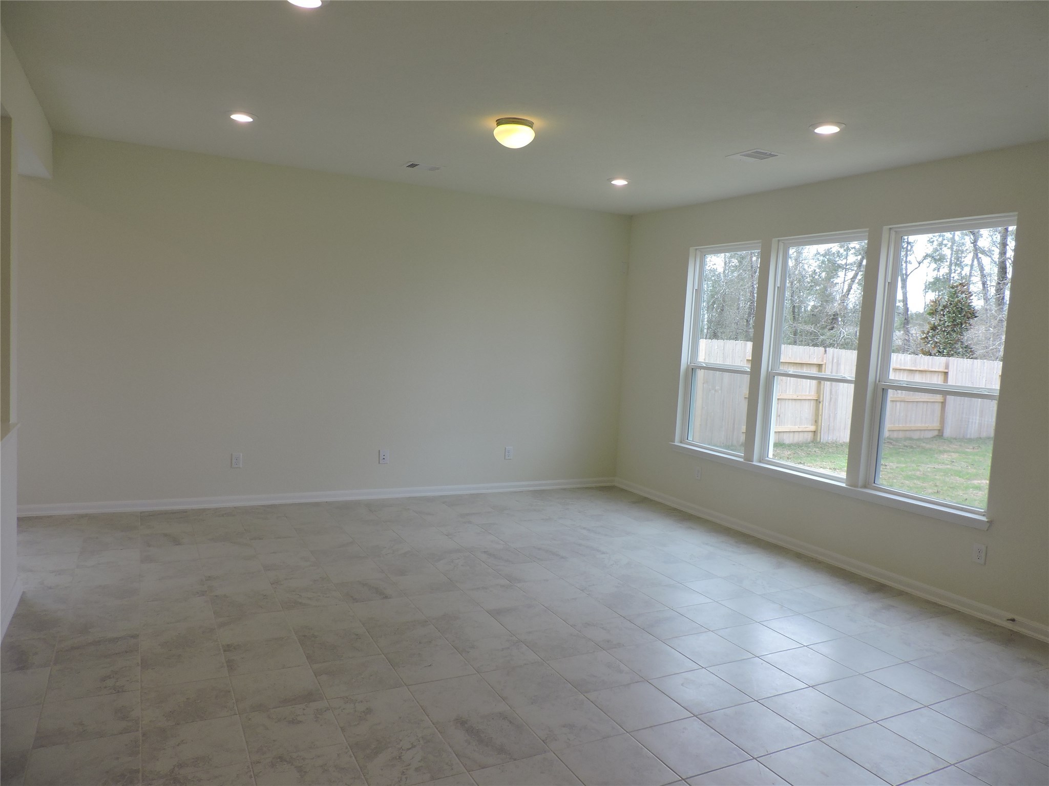 1122 Epworth Ct. Conroe, TX 77304 - Photo 10 of 35 a view of an empty room with a window