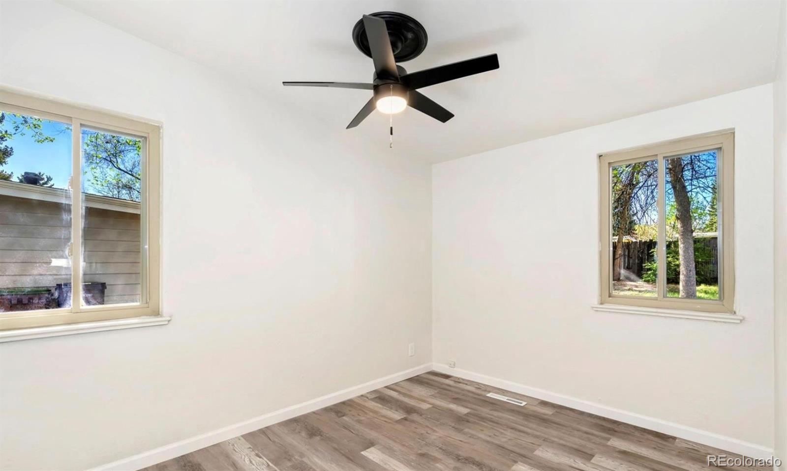 635 West Prospect Road Fort Collins, CO 80526 - Photo 13 of 17 a view of a room with a window and a ceiling fan