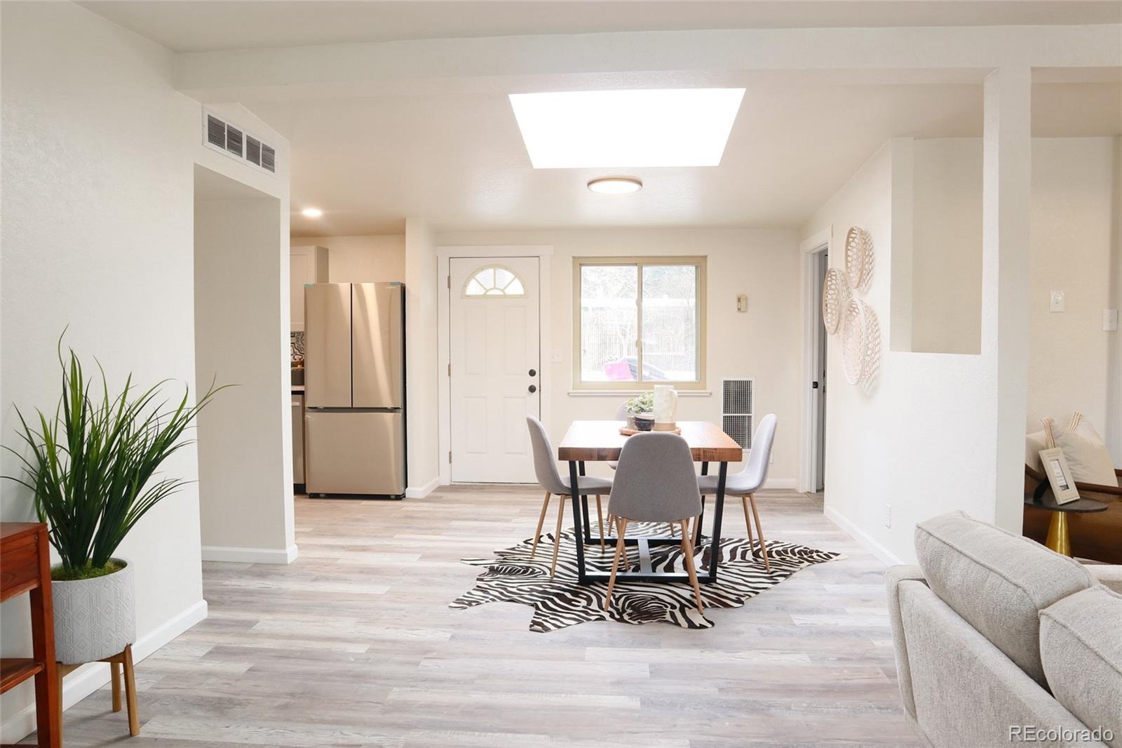 635 West Prospect Road Fort Collins, CO 80526 - Photo 15 of 17 a view of a dining room with furniture and wooden floor