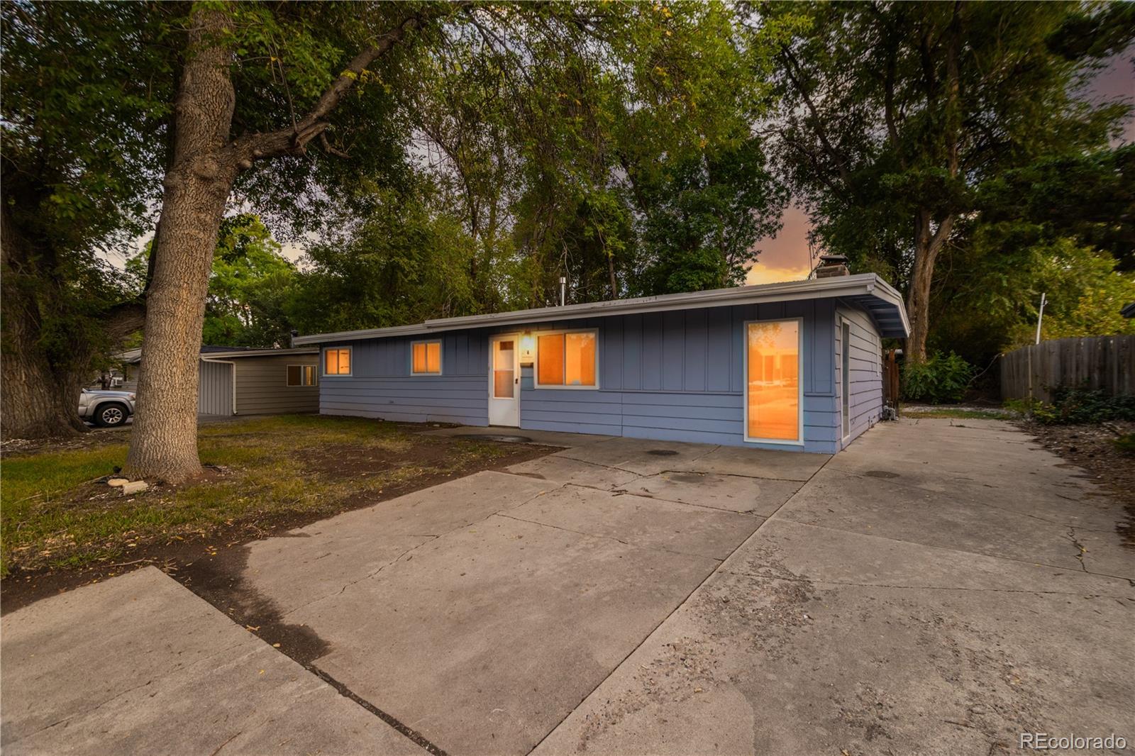 635 West Prospect Road Fort Collins, CO 80526 - Photo 2 of 17 a front view of a house with a yard and garage