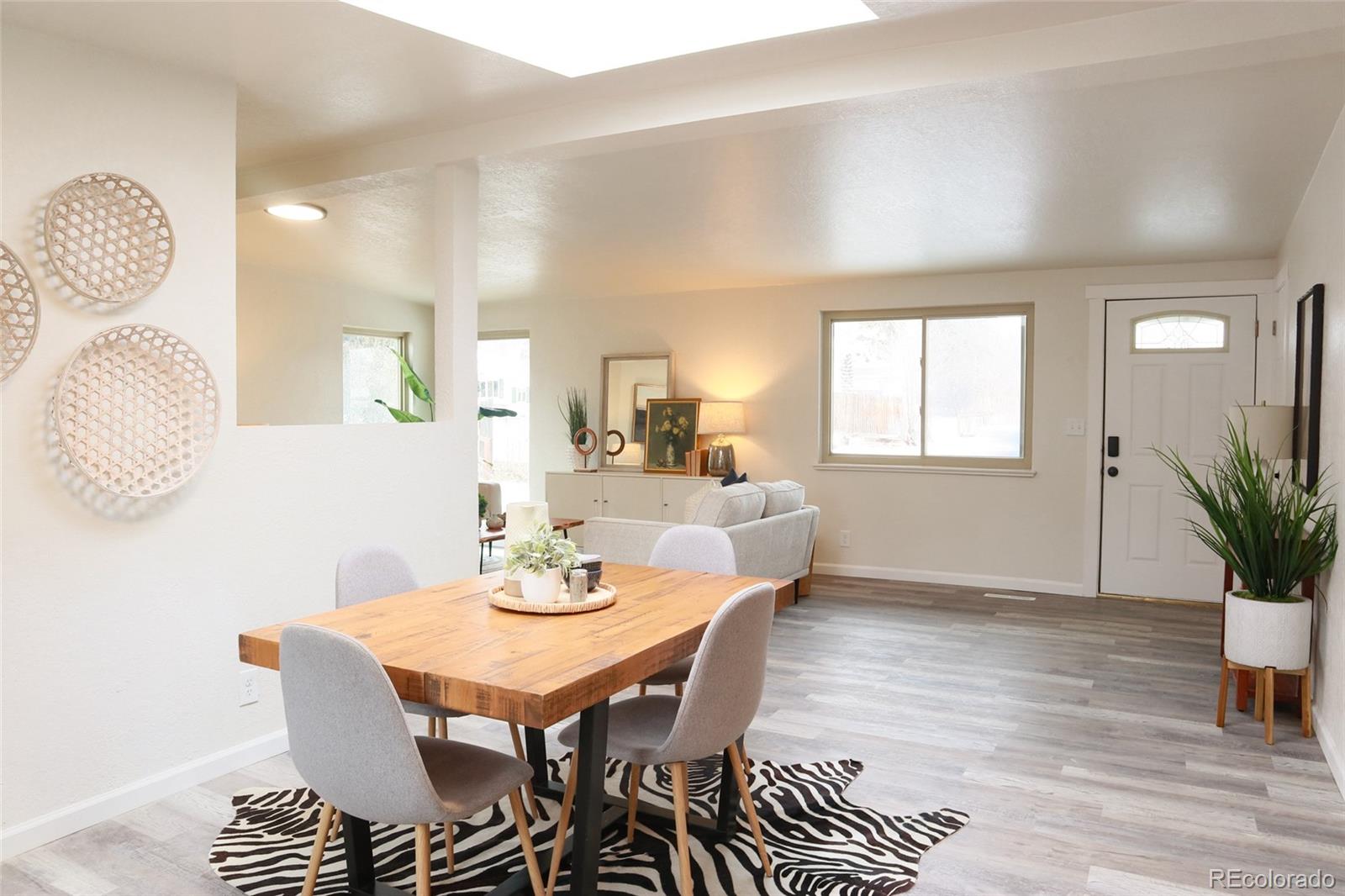 635 West Prospect Road Fort Collins, CO 80526 - Photo 7 of 17 a view of a dining room with furniture and wooden floor