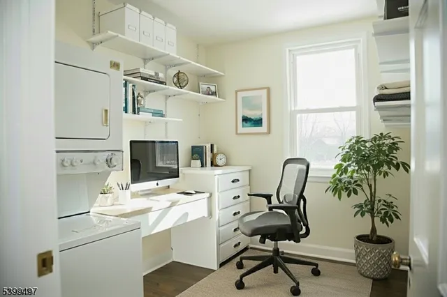 a view of a workspace with furniture