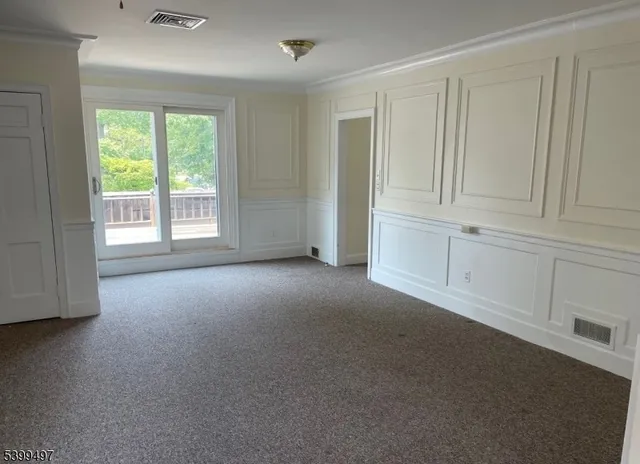 a view of empty room with windows