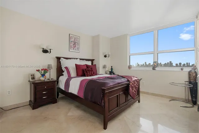 a bedroom with a bed and dresser