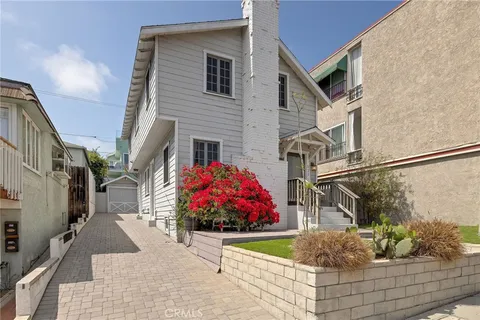 an aerial view of a city with ocean view