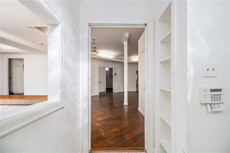 1112 Delaware Avenue Southeast Atlanta, GA 30316 - Photo 3 of 30 a view of a hallway with wooden floor and living room