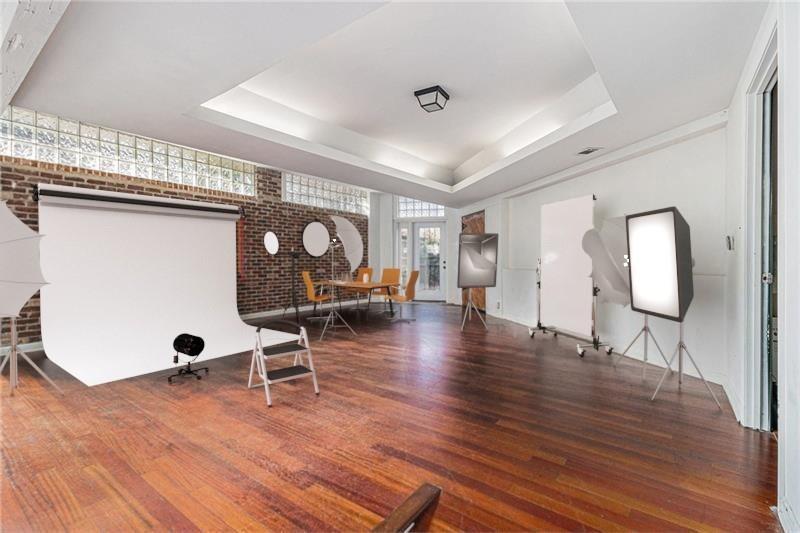 1112 Delaware Avenue Southeast Atlanta, GA 30316 - Photo 4 of 30 a view of a room with wooden floor and furniture