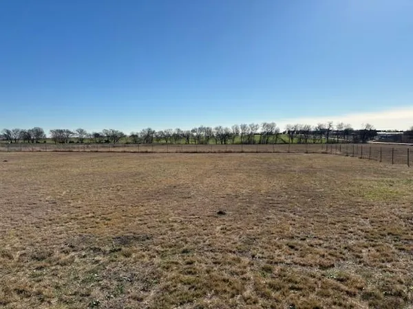 a view of a lake with houses in the back