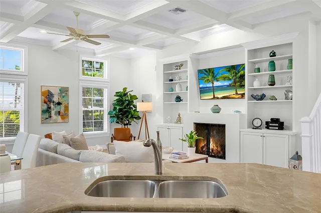 a kitchen with a sink and a fireplace