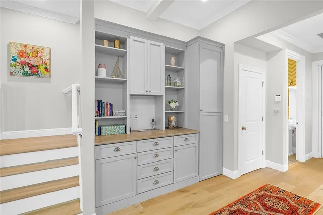 a bedroom with a bed and a cabinets