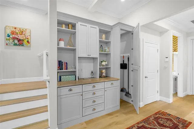 a kitchen with a refrigerator and cabinets