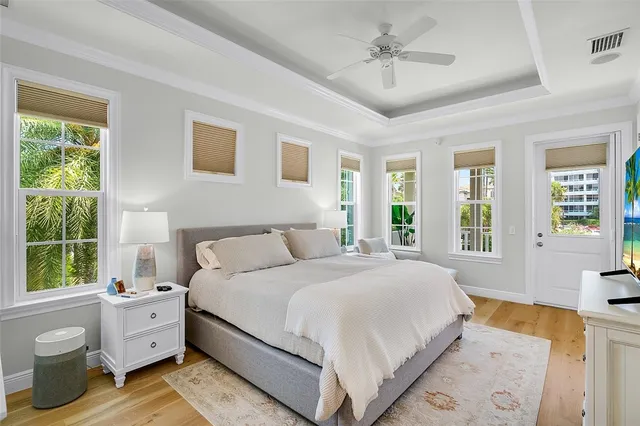 a spacious bedroom with a large bed and a window