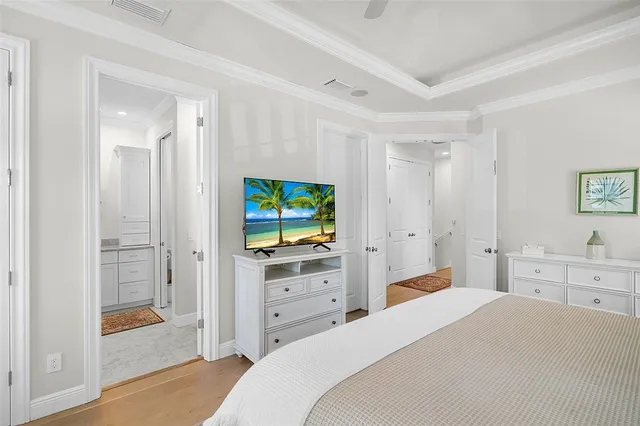 a bedroom with a bed and a dresser