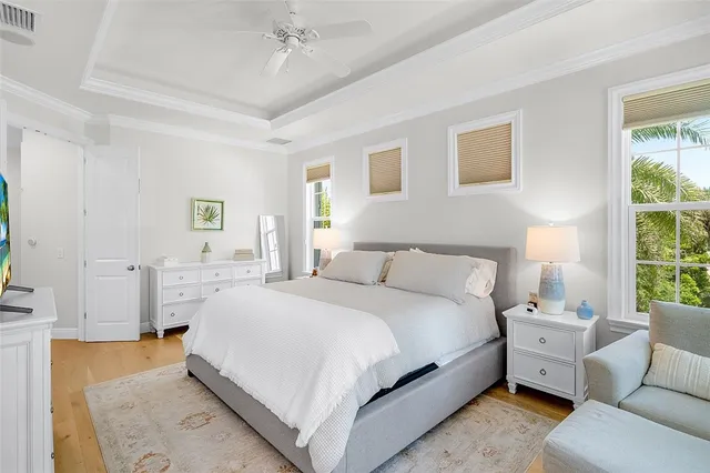 a spacious bedroom with a bed and a couch