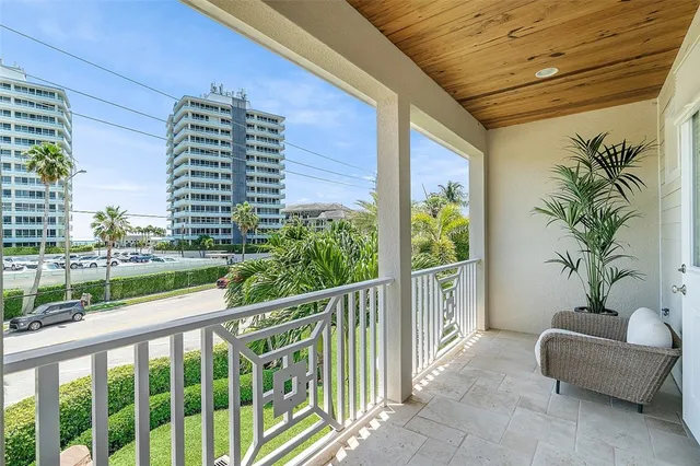 a view of balcony with furniture
