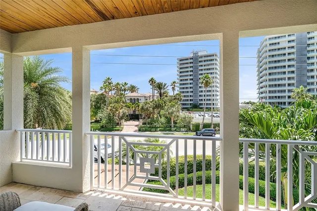 a view of a balcony and a floor to ceiling window