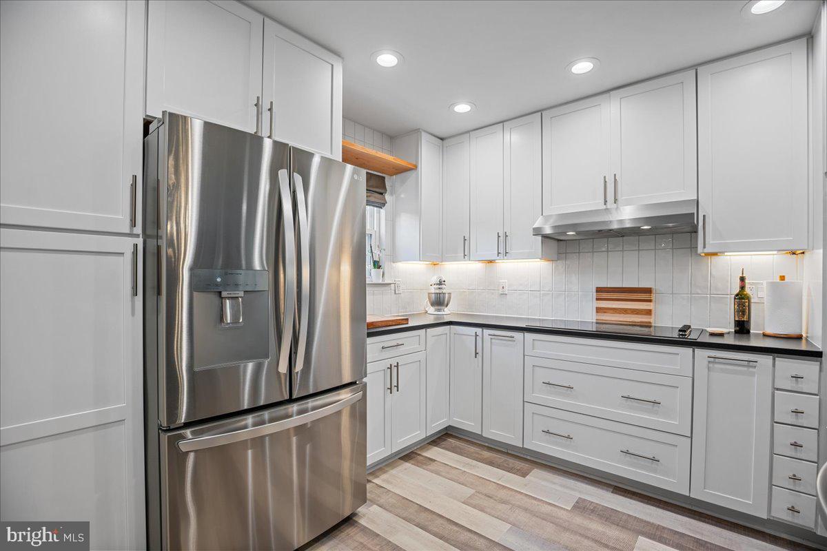 1755 Lottie Fowler Road Prince Frederick, MD 20678 - Photo 13 of 76 a kitchen with granite countertop stainless steel appliances and refrigerator