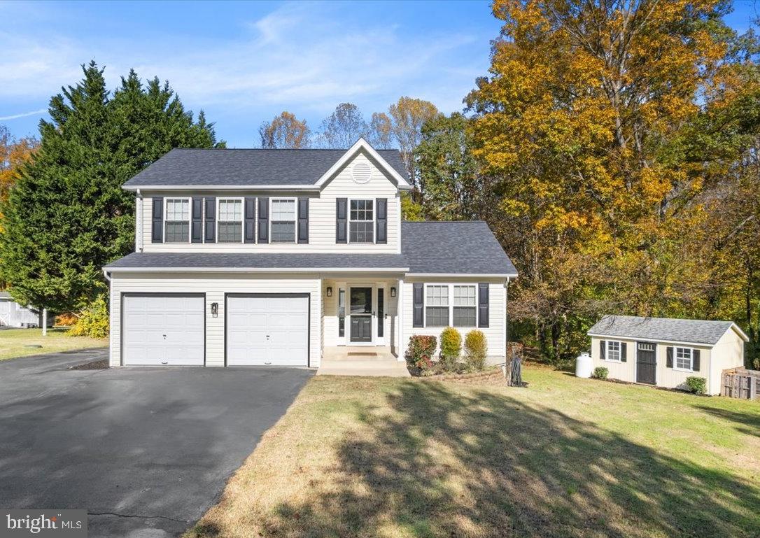 1755 Lottie Fowler Road Prince Frederick, MD 20678 - Photo 2 of 76 a front view of a house with a yard