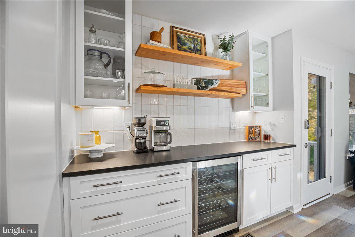 1755 Lottie Fowler Road Prince Frederick, MD 20678 - Photo 23 of 76 a kitchen with stainless steel appliances cabinets and a window