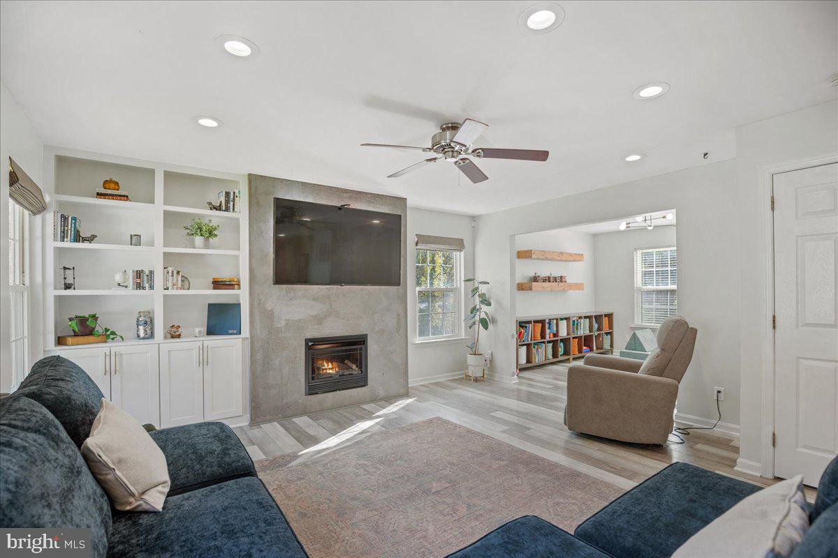 1755 Lottie Fowler Road Prince Frederick, MD 20678 - Photo 29 of 76 a living room with furniture and a fireplace