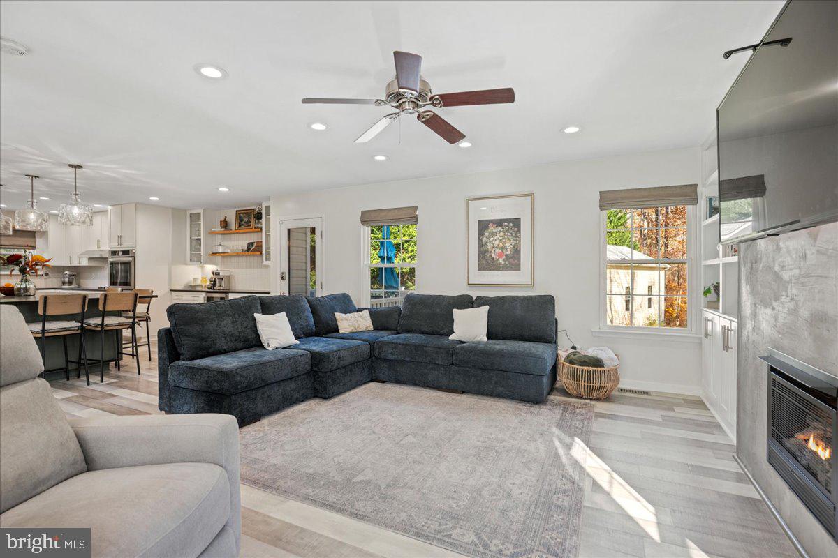 1755 Lottie Fowler Road Prince Frederick, MD 20678 - Photo 32 of 76 a living room with furniture and a fireplace