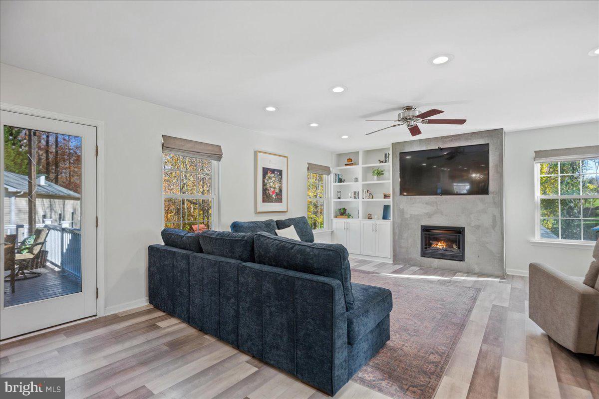 1755 Lottie Fowler Road Prince Frederick, MD 20678 - Photo 34 of 76 a living room with furniture and a fireplace
