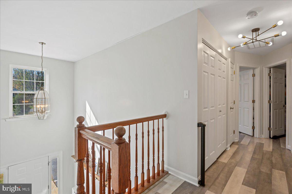 1755 Lottie Fowler Road Prince Frederick, MD 20678 - Photo 40 of 76 a view of a hallway with windows and stairs