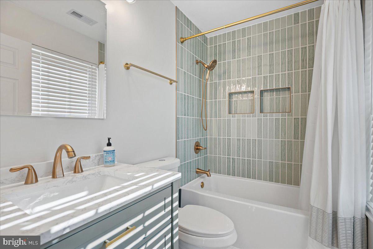 1755 Lottie Fowler Road Prince Frederick, MD 20678 - Photo 43 of 76 a bathroom with a sink a toilet and a bathtub